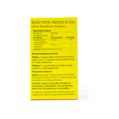 Close-up of Red Pine Needle Oil Capsules packaging with nutrition facts and dosage instructions on a yellow background.